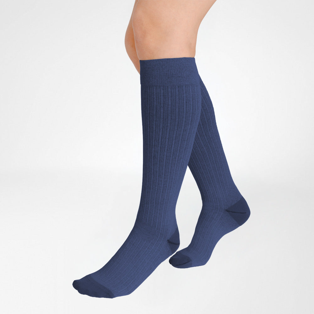 A pair of Bauerfeind Medical Compression knee-high cotton air socks worn on a person's legs, shown against a plain white background.
