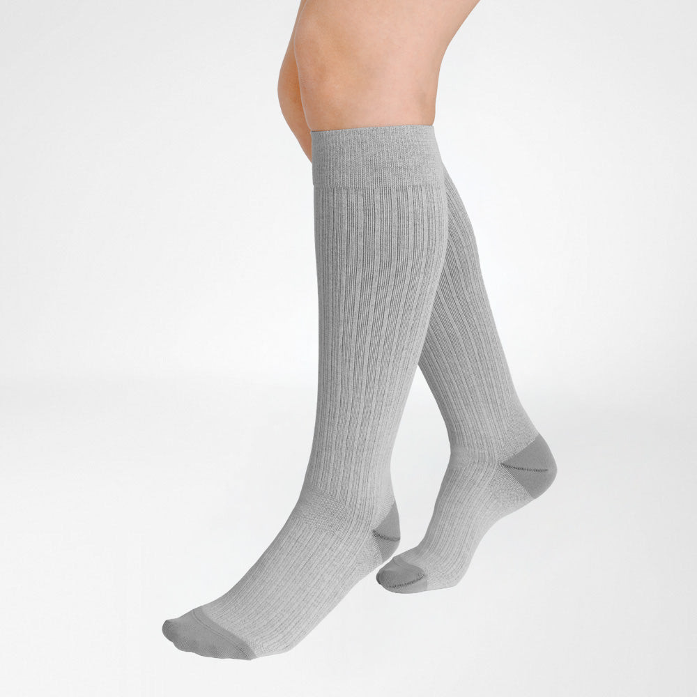 A pair of Bauerfeind Medical Compression knee-high cotton air socks worn on a person's legs, shown against a plain white background.