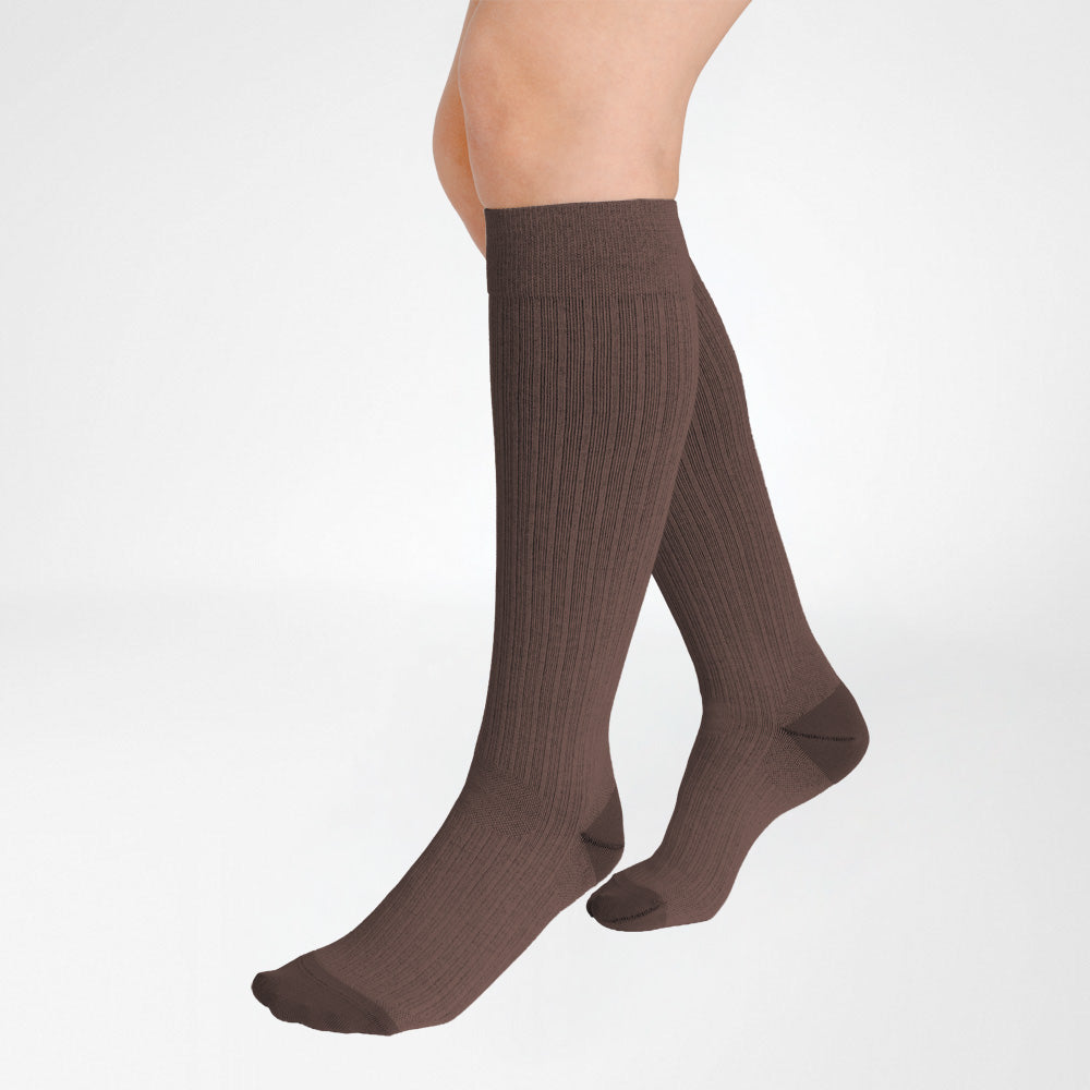 A pair of Bauerfeind Medical Compression knee-high cotton air socks worn on a person's legs, shown against a plain white background.
