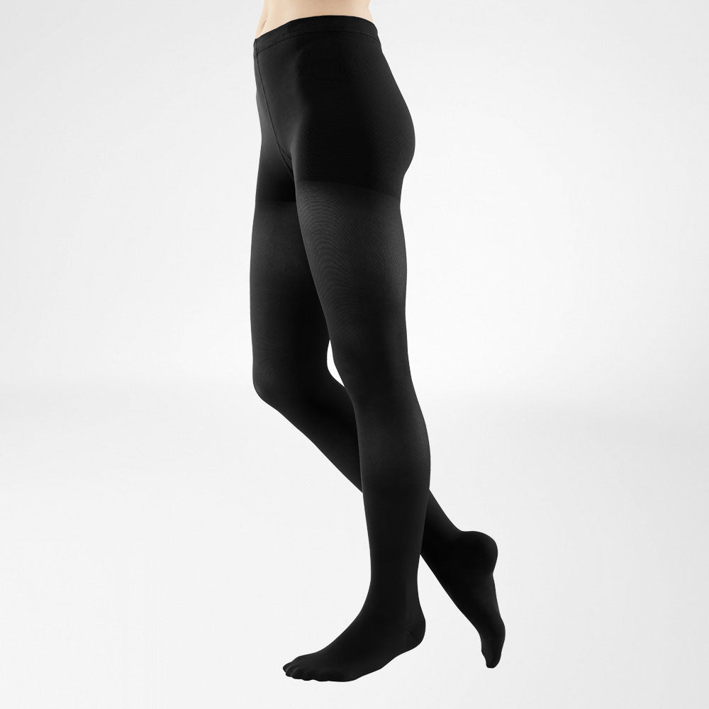 person wearing the full bauerfeind medical venotrain soft compression stockings in black 