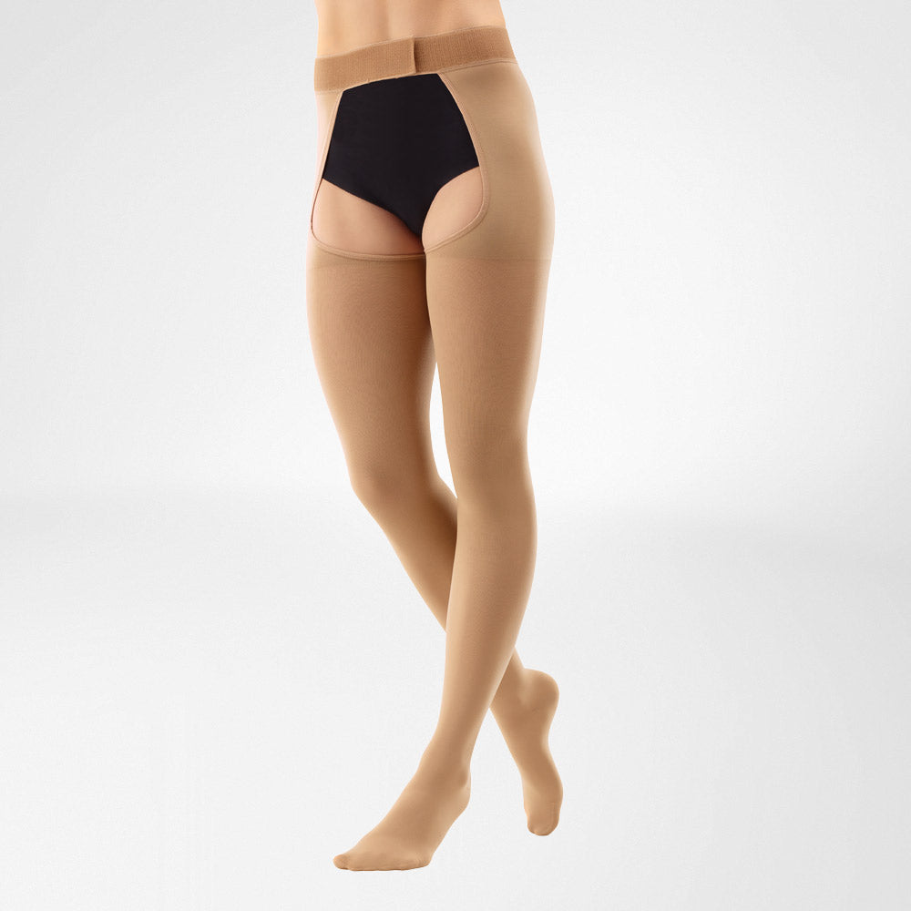 person wearing the double leg thigh high bauerfeind medical venotrain soft compression stockings in color carmel